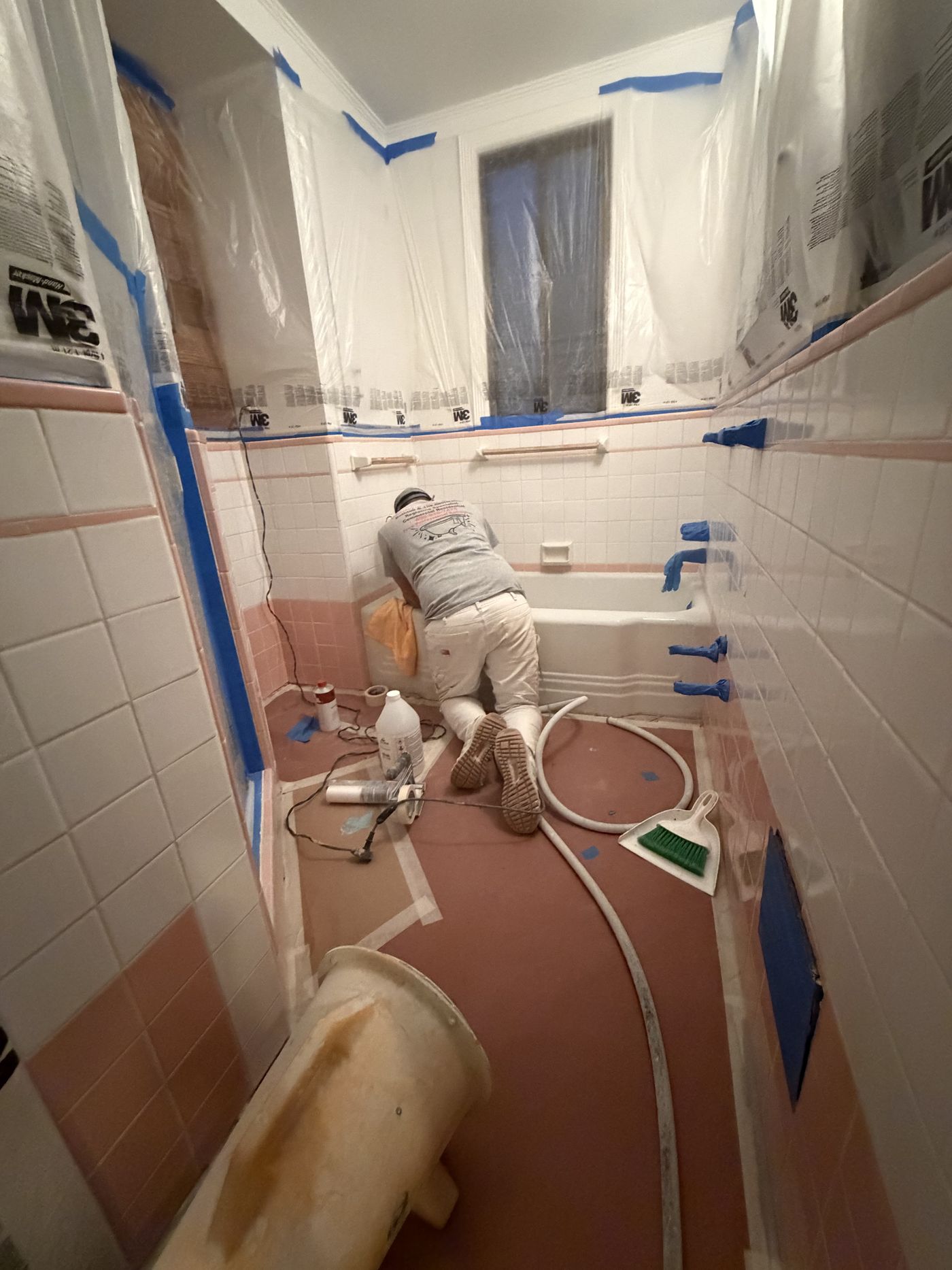Danny refinishing a bathtub on the job